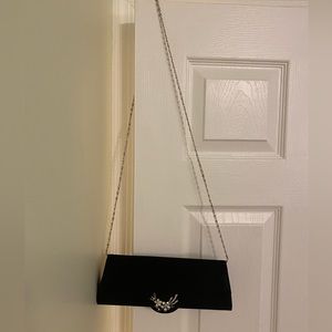 Black purse with jewel decoration